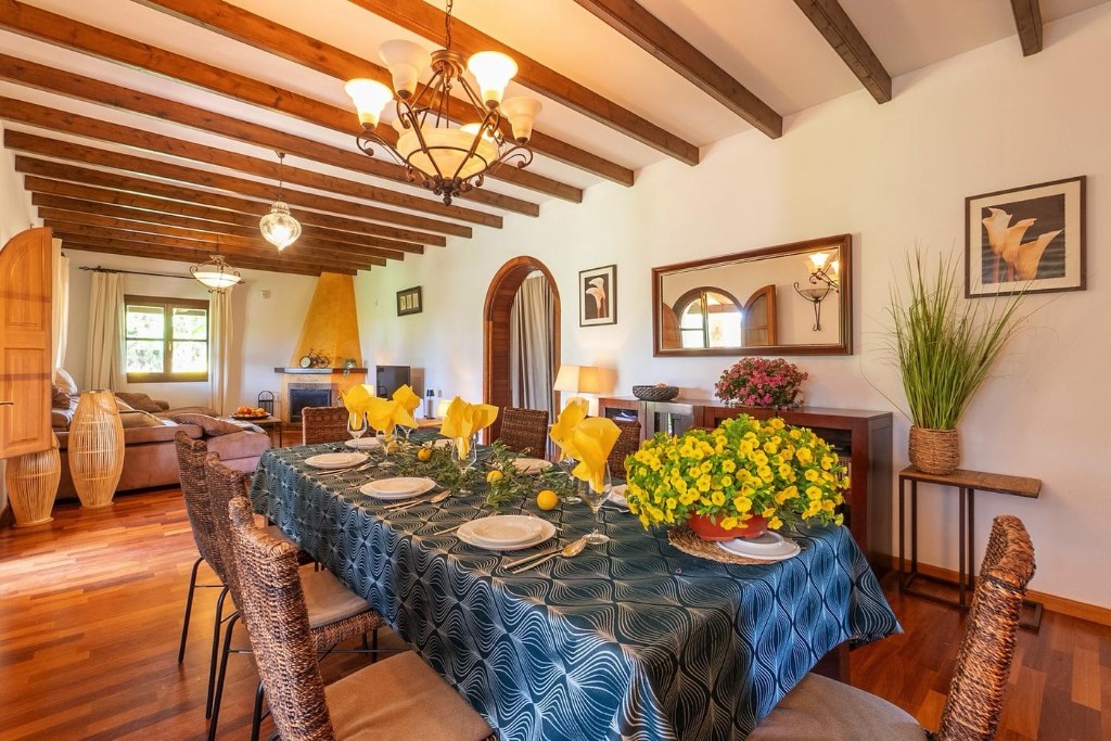 Living room with sofa, dining table and fireplace