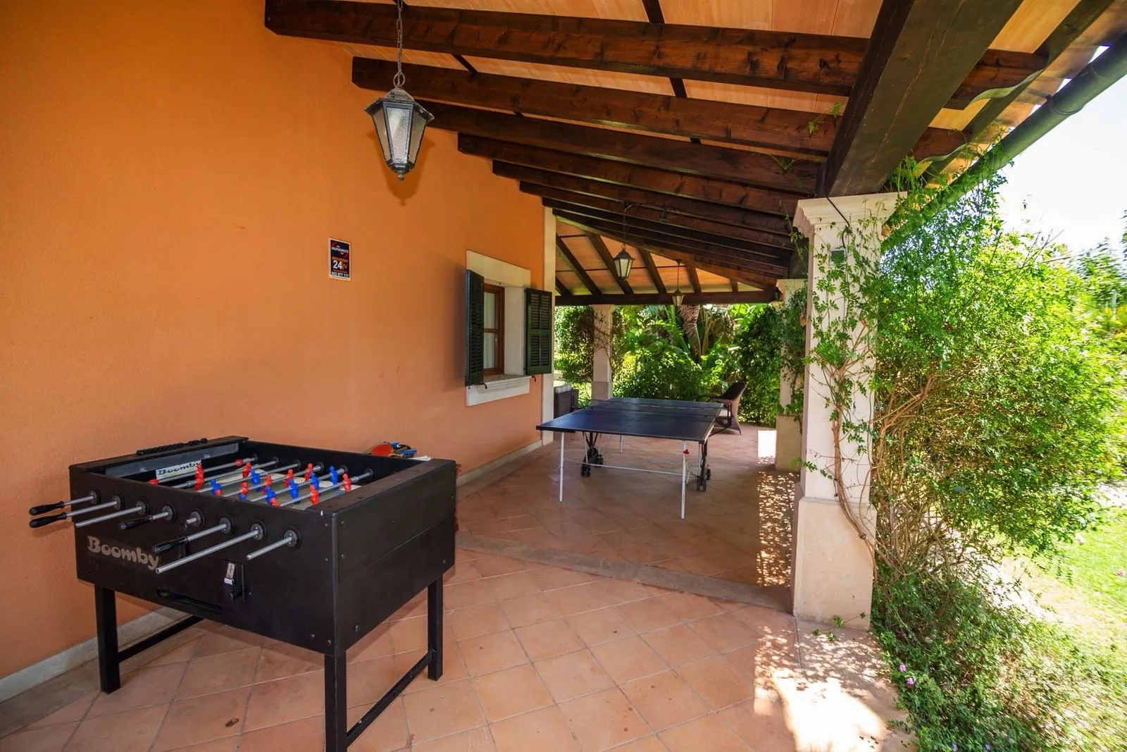 Table football and table tennis in a covered outdoor area